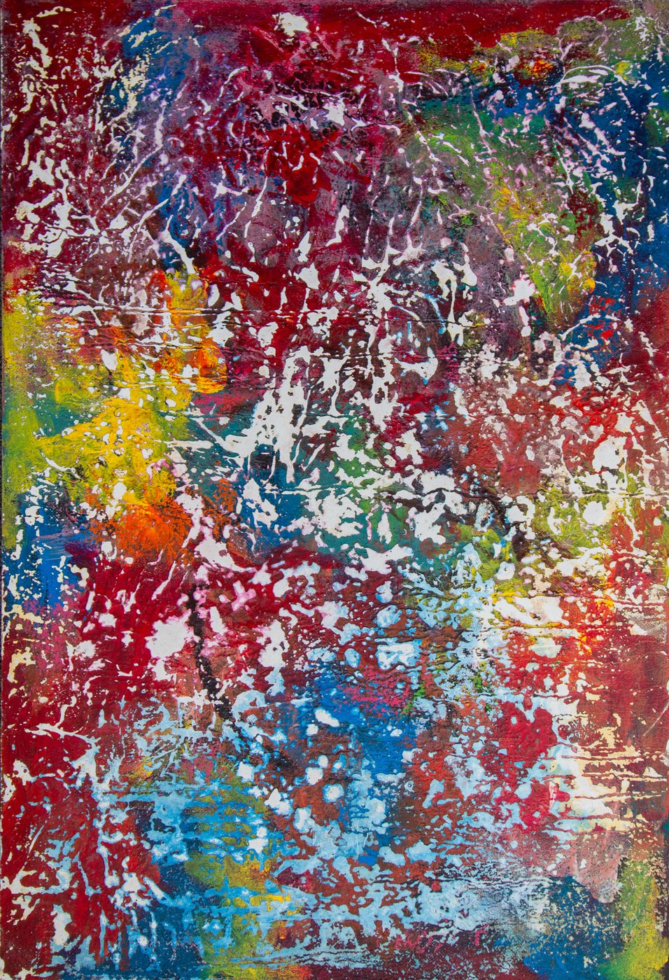 Portrait-format painting. Dense splatter in red, blue, green, and yellow over a white-flecked ground.